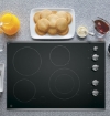 Picture of GE 30 Inch Smoothtop Electric Cooktop with Silver Knobs - Stainless Steel on Black